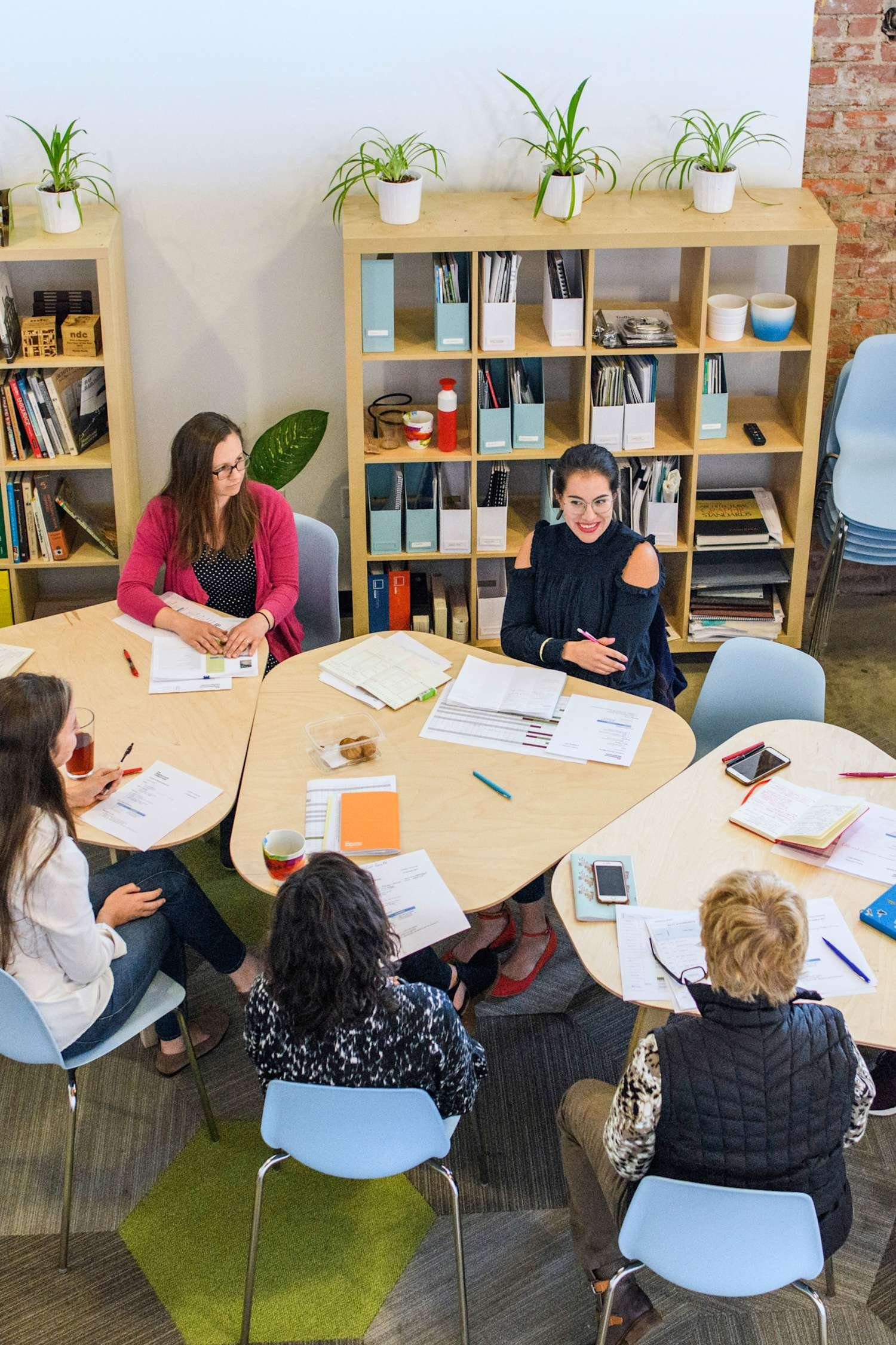 A diverse nonprofit team collaborating around a table